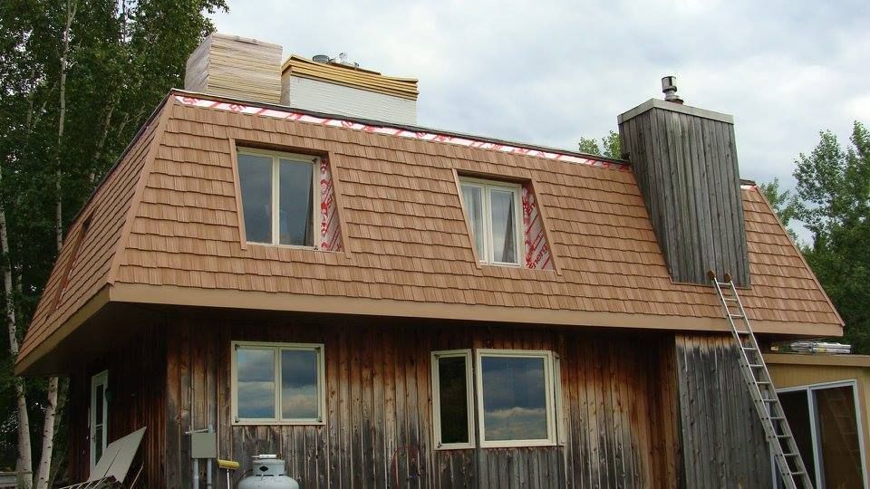 Sandy surface with wave-like patterns and long shadows, bathed in warm light.