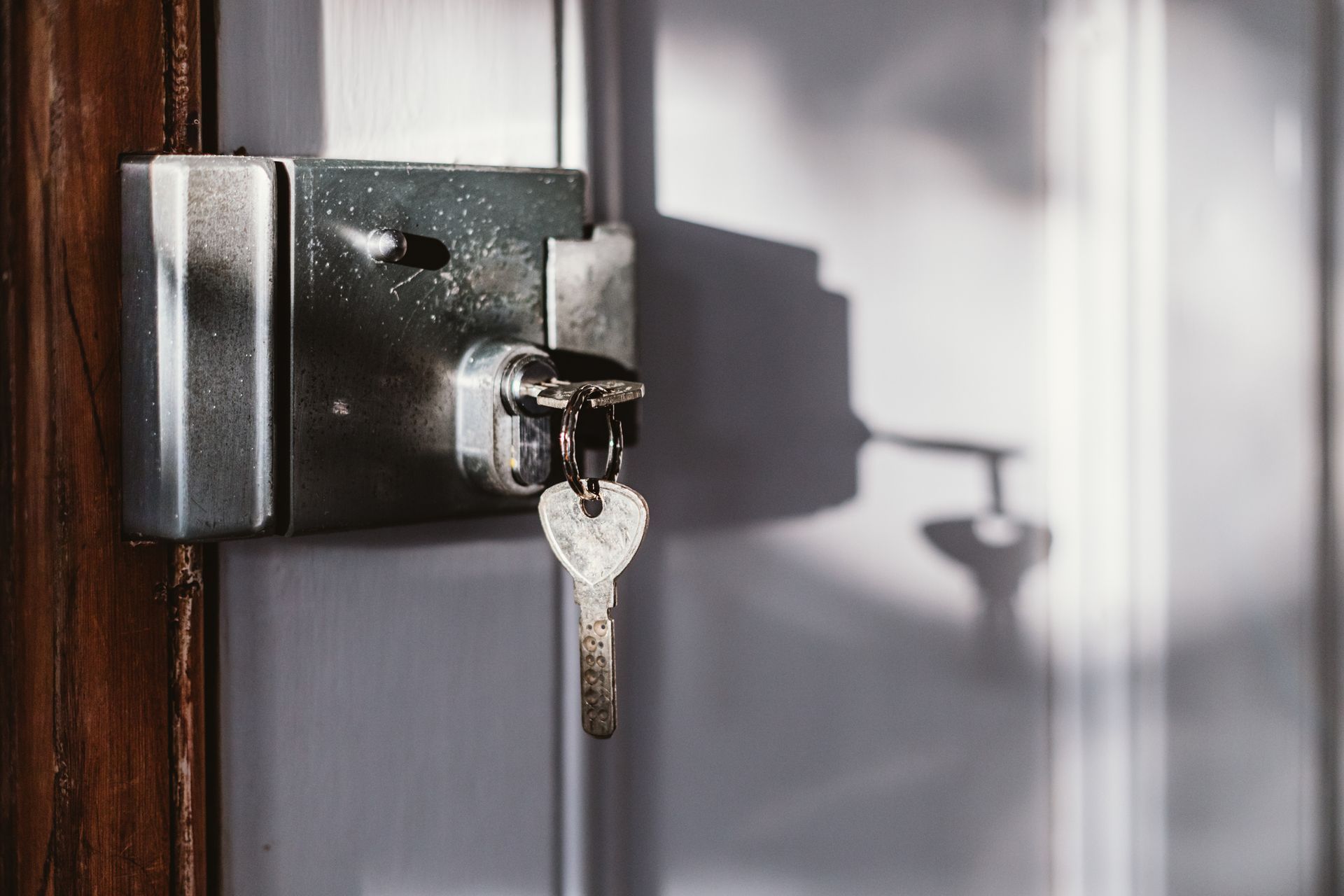A close up of a door lock with a key in it.