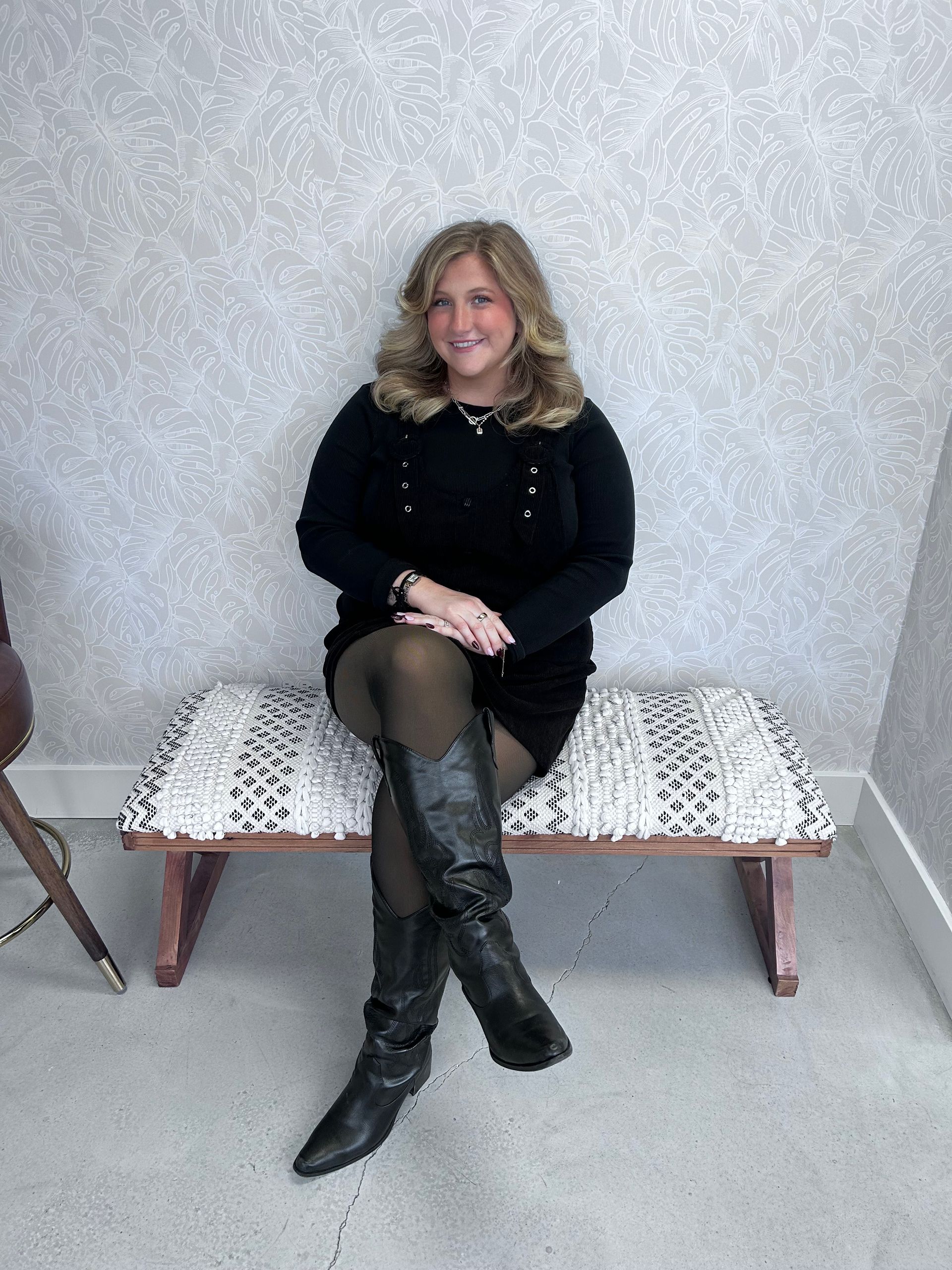 A hair salon with a chair and a mirror