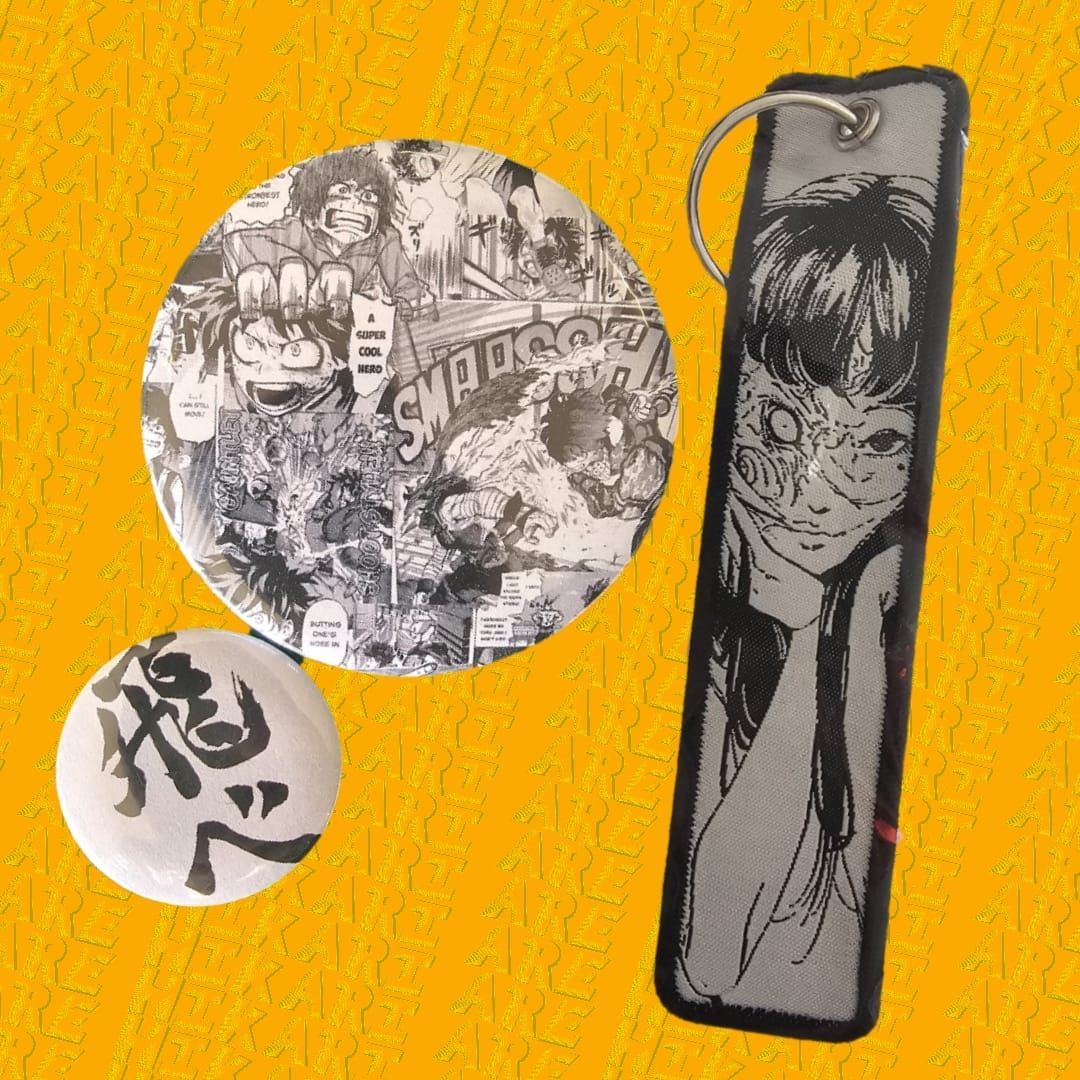 Una persona tiene in mano un segnalibro davanti a una parete di adesivi.