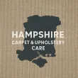 The logo for hampshire carpet and upholstery care is blue and black.