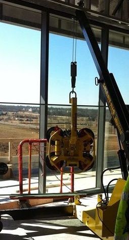 MicroCranes®  mini crane. A mini crane hoist used in construction. Compact design, safely lifts up to 2,000 pounds.