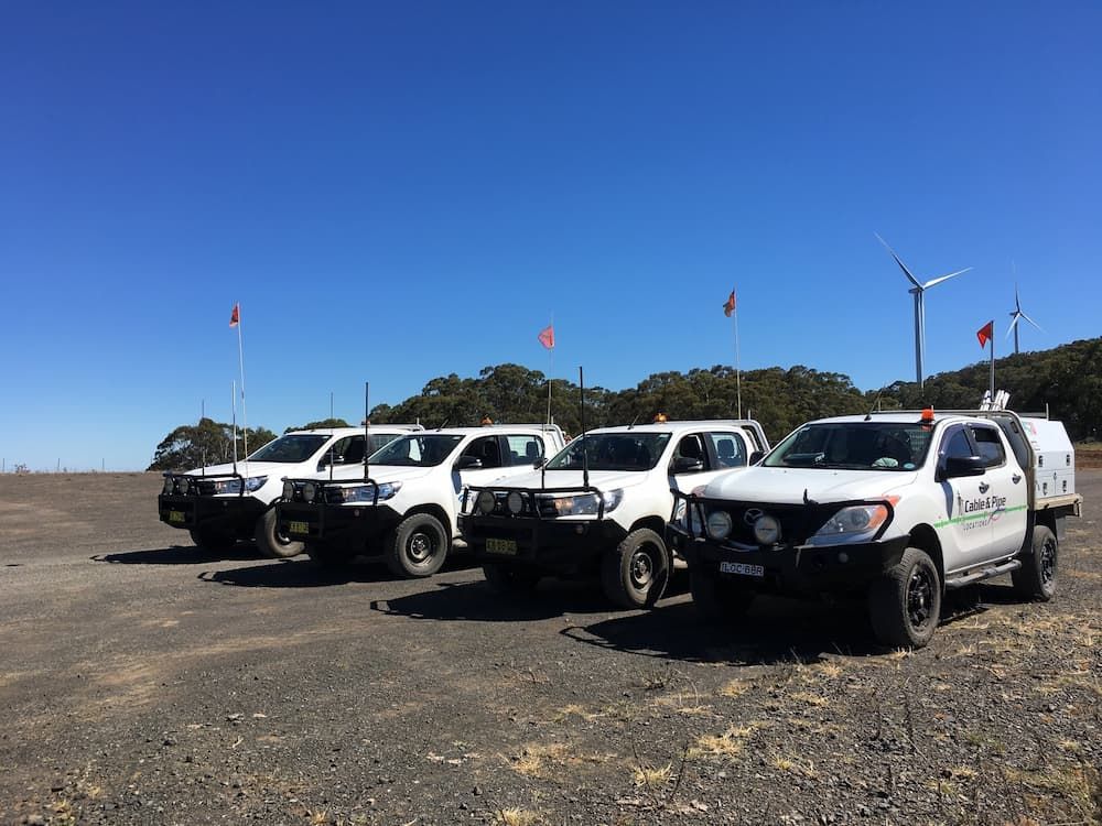 Four White Cars — Cable & Pipe Locations in Woolgoolga, NSW