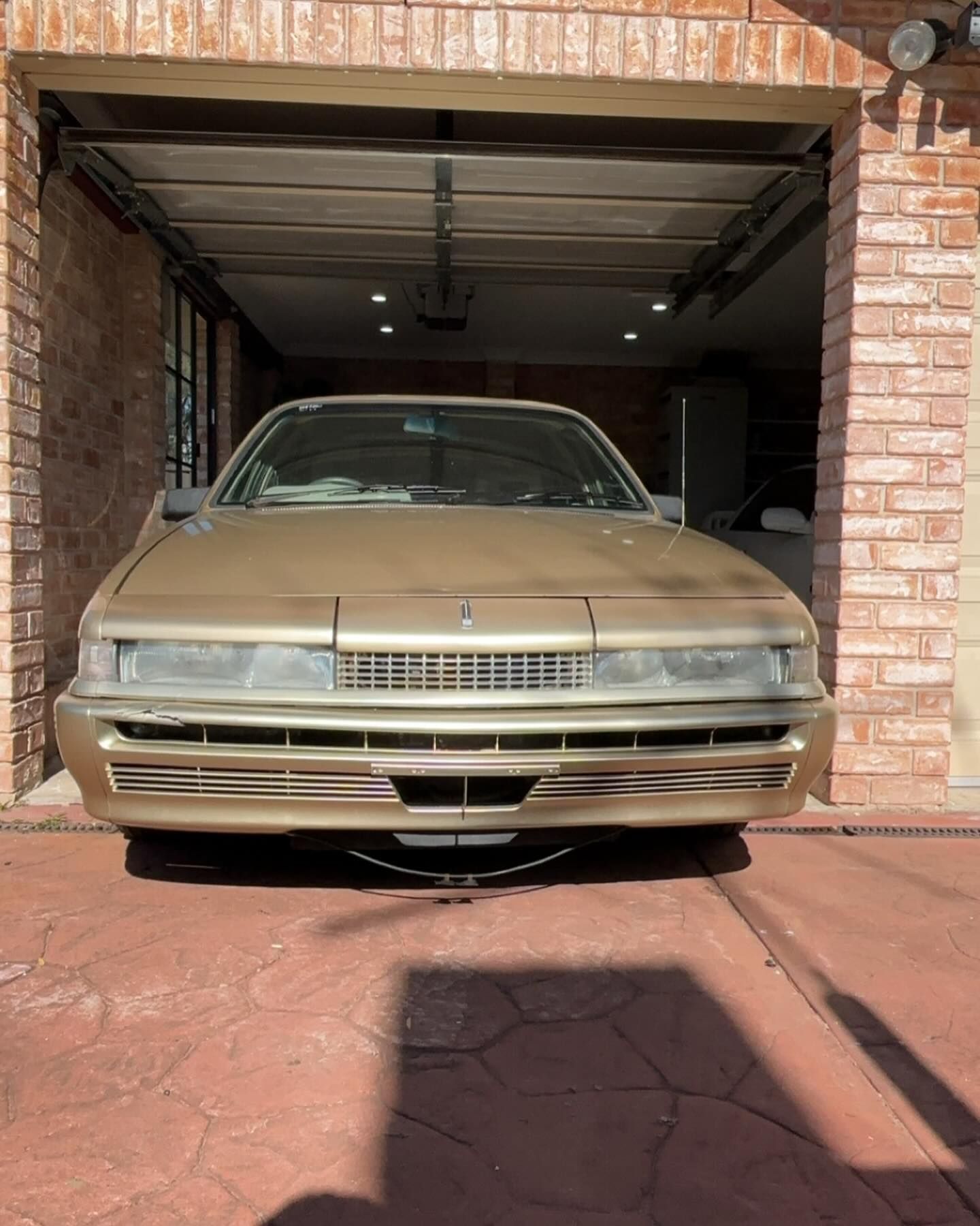 Gold Classic Car Parked Inside a Brick Garage — Amrix Automotive In Sefton, NSW