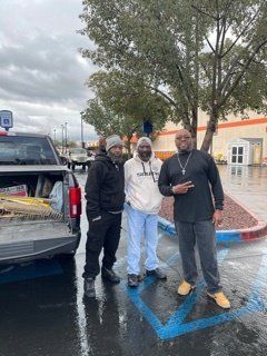 Members Standing by Truck