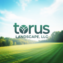 Logo for Torus Landscape LLC over a blurred field and sky.