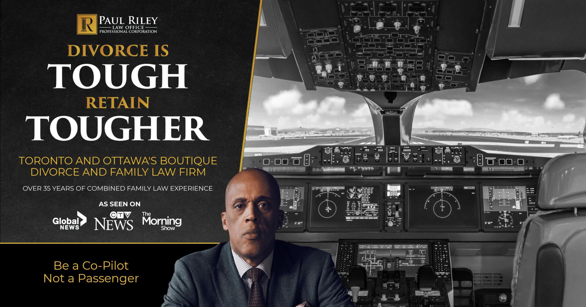 A man in a suit and tie is sitting in front of a sign that says divorce is tough retain tougher