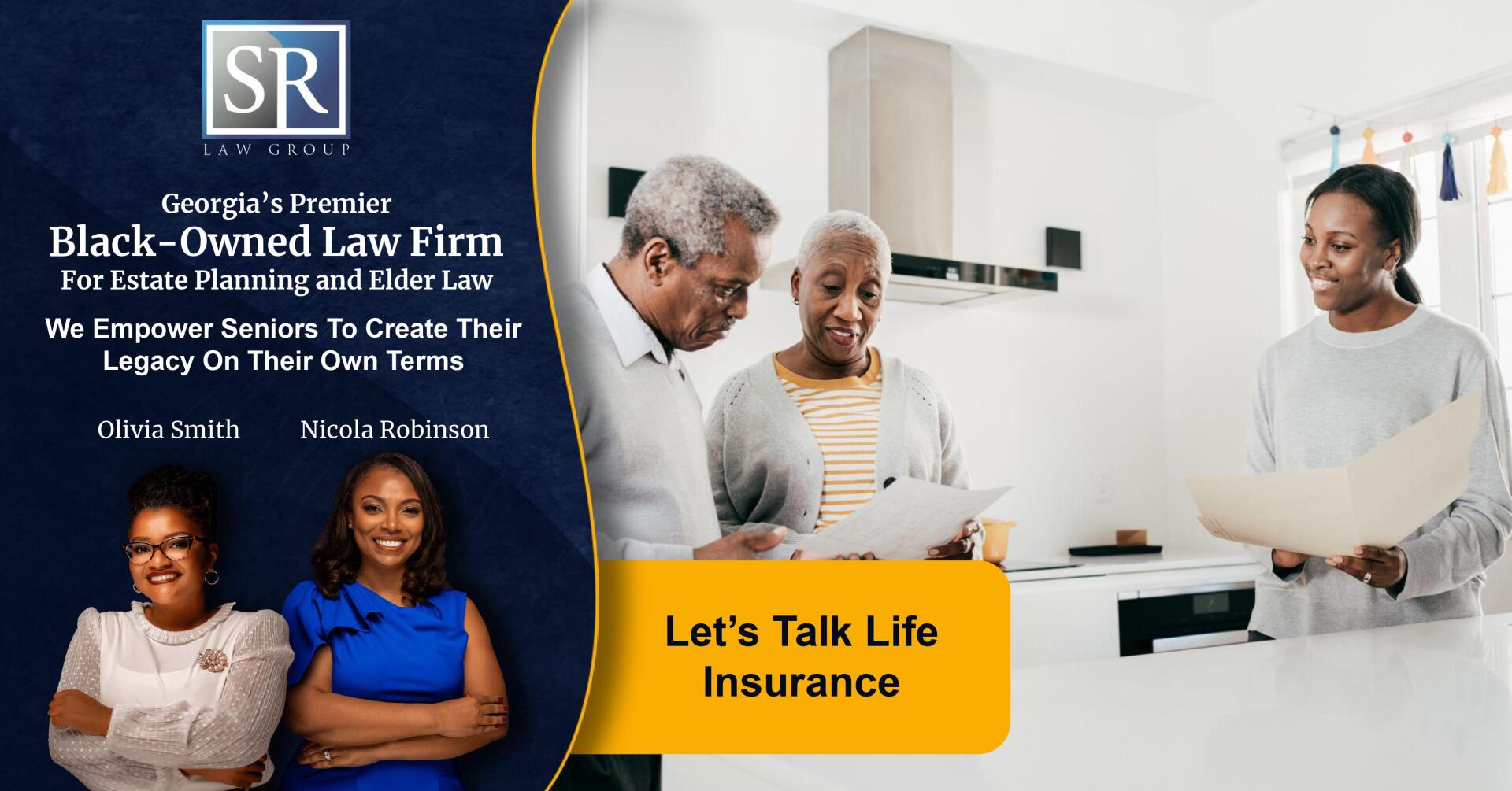 A group of people are standing in a kitchen looking at papers.