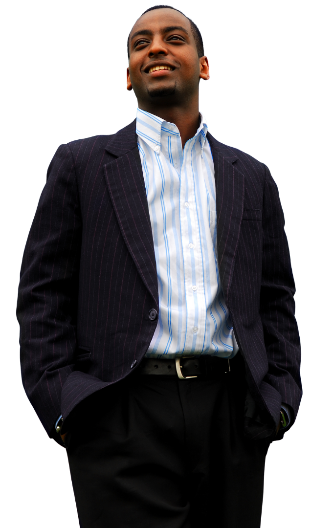A man in a suit is standing with his hands in his pockets
