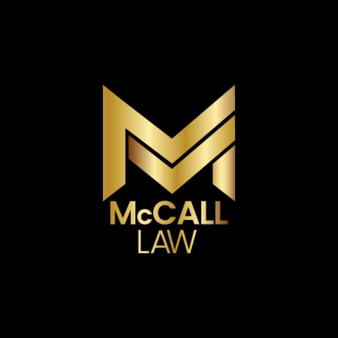 A gold logo for mccall law on a black background