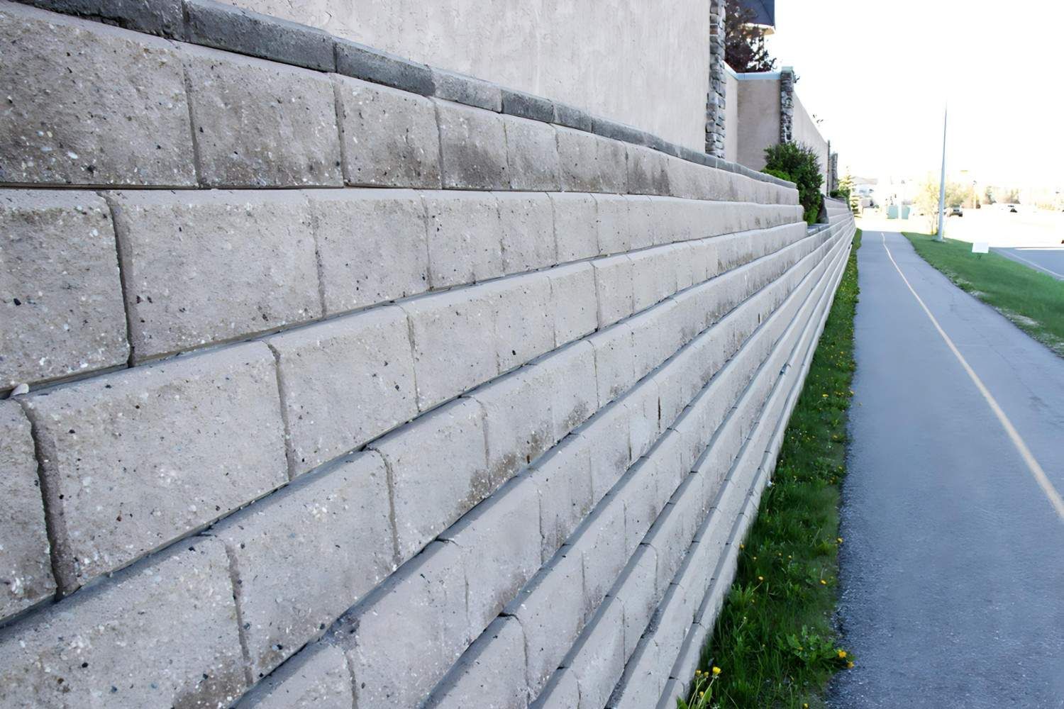 A Brick Wall Along the Side of A Road — B3 Plumbing in Flynn, ACT