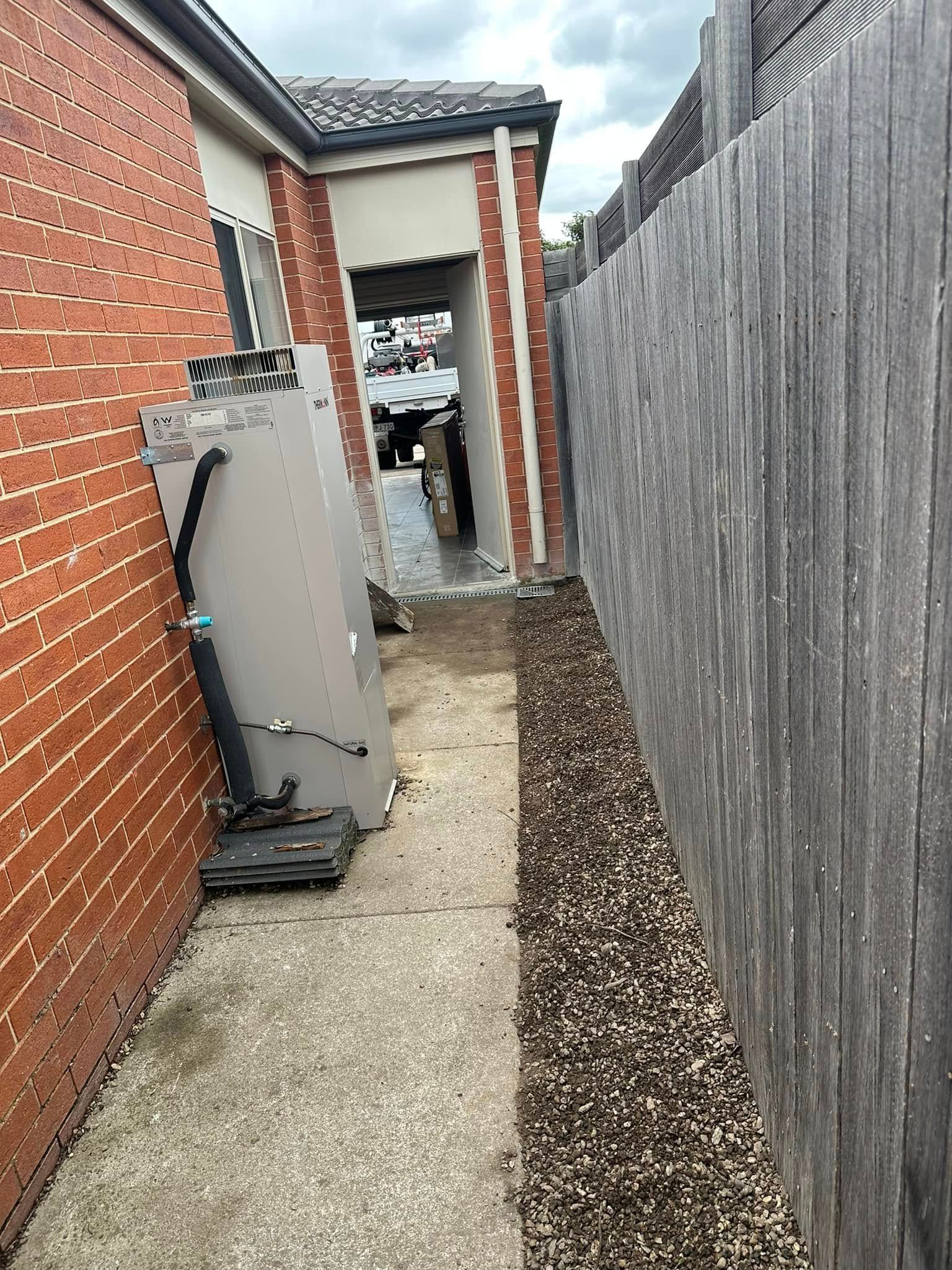 A Room with A Heater and A Water Heater in It — B3 Plumbing in Flynn, ACT