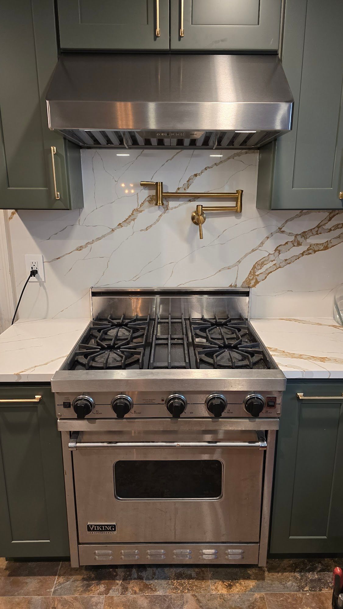 A person in a white apron is working in a kitchen