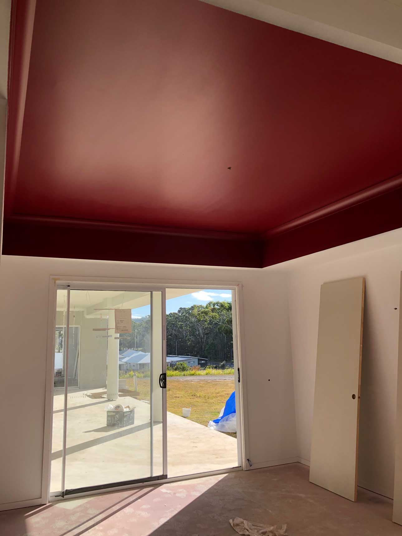 close view of red paint on ceiling