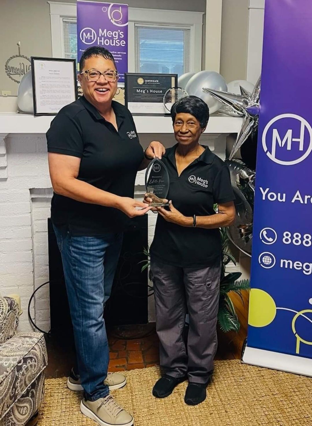 A man and a woman are standing next to each other in a room.