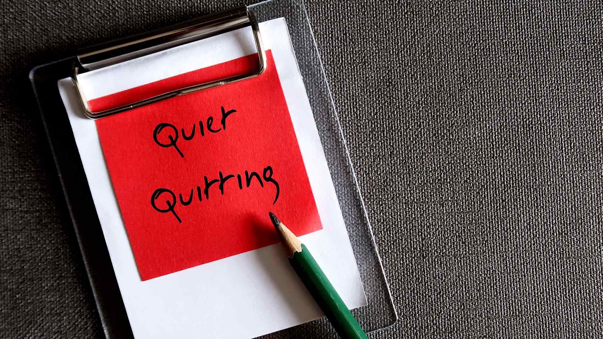 Clipboard with red sticky note reading 