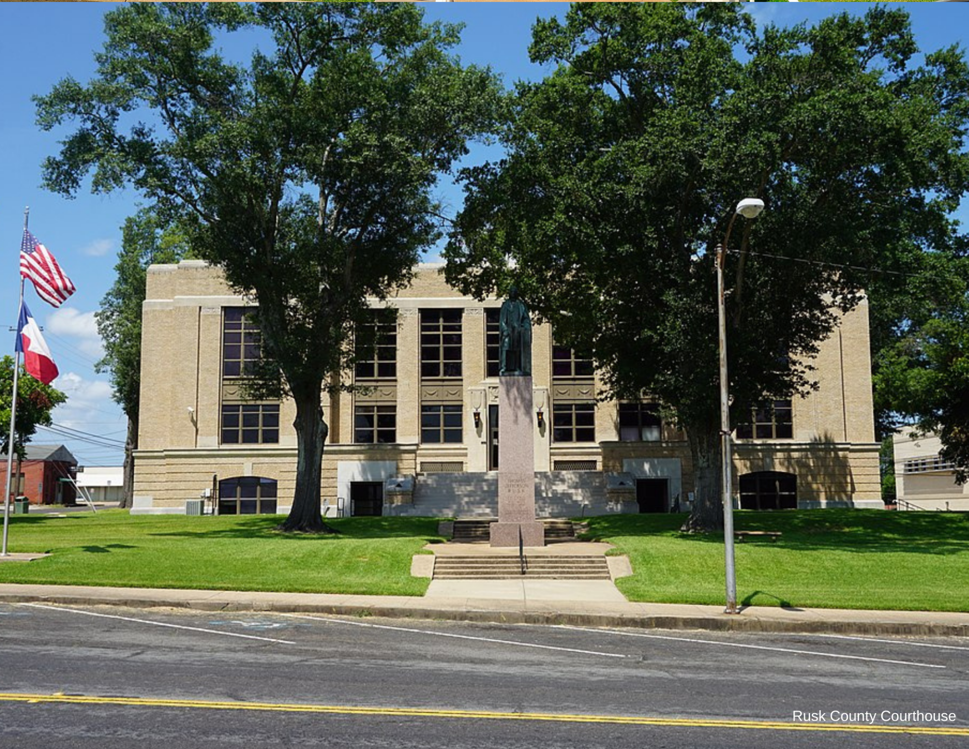 A large building with a flag in front of it