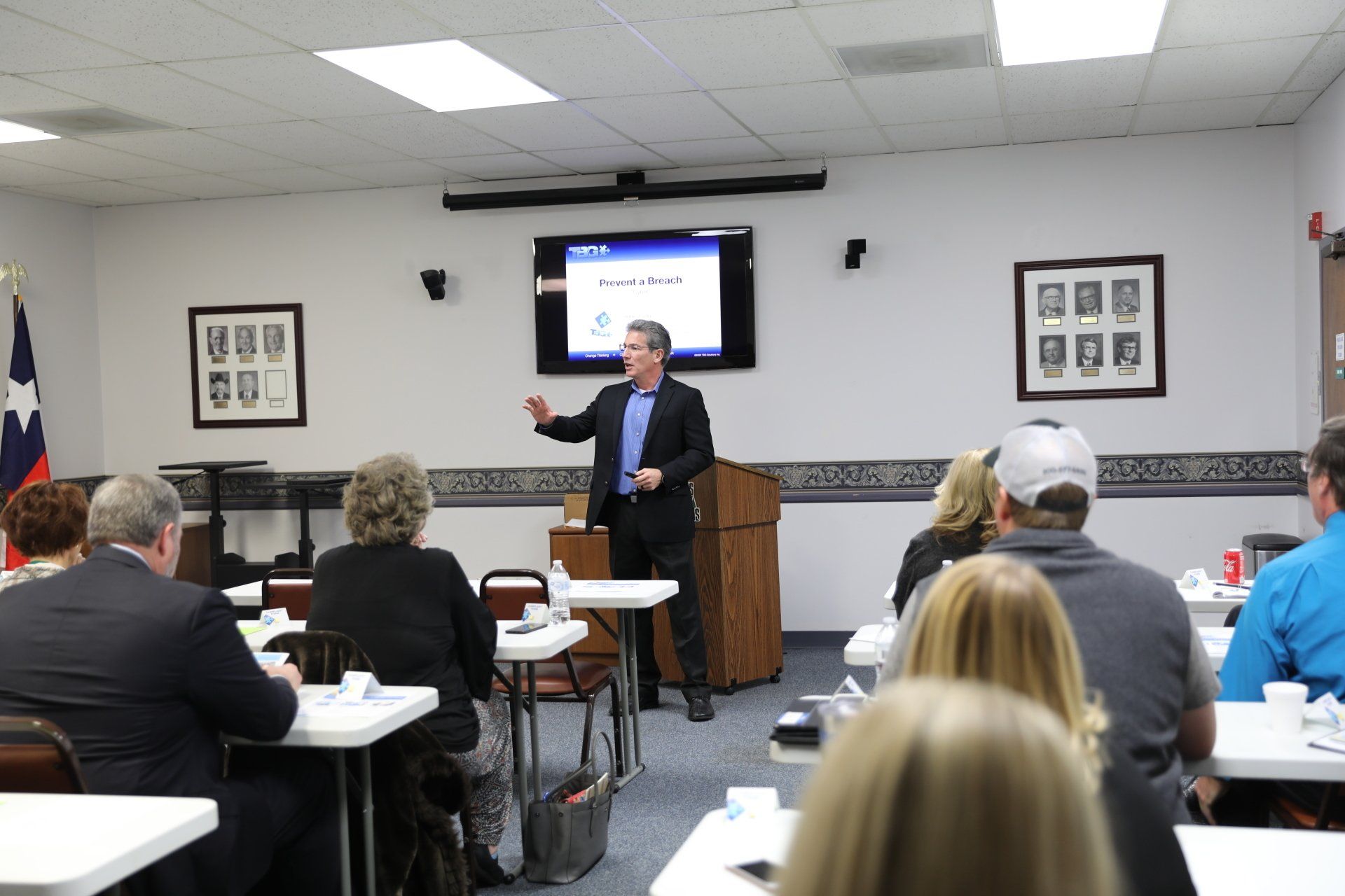 A man is giving a presentation to a group of people