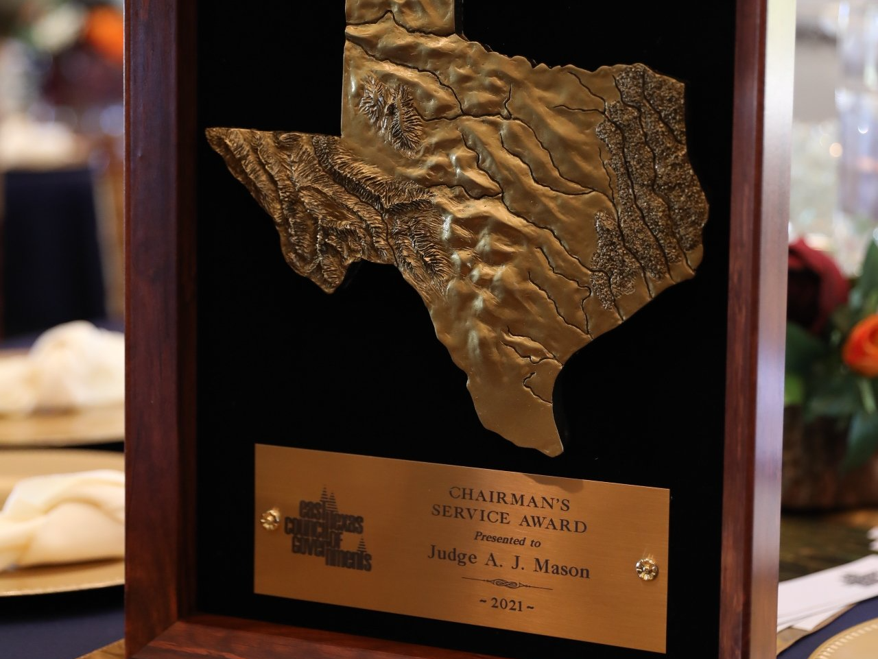 A plaque with a picture of texas on it