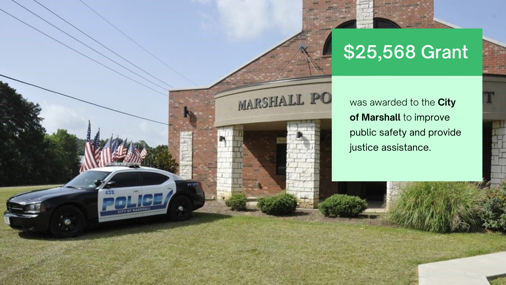 A police car is parked in front of a marshall police station