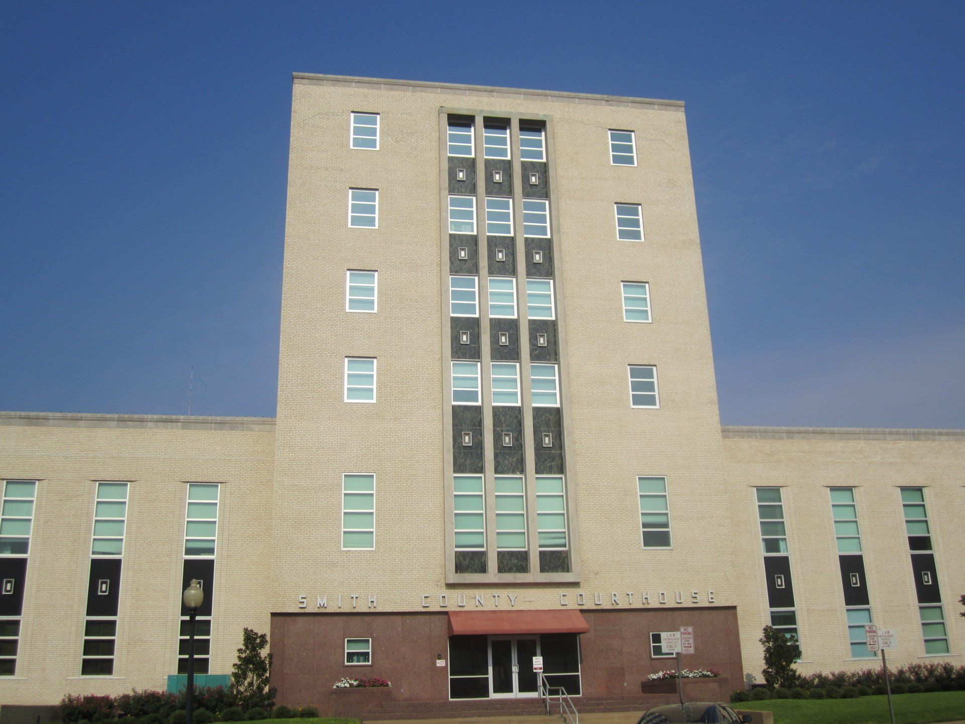 A large brick building with a blue sky in the background