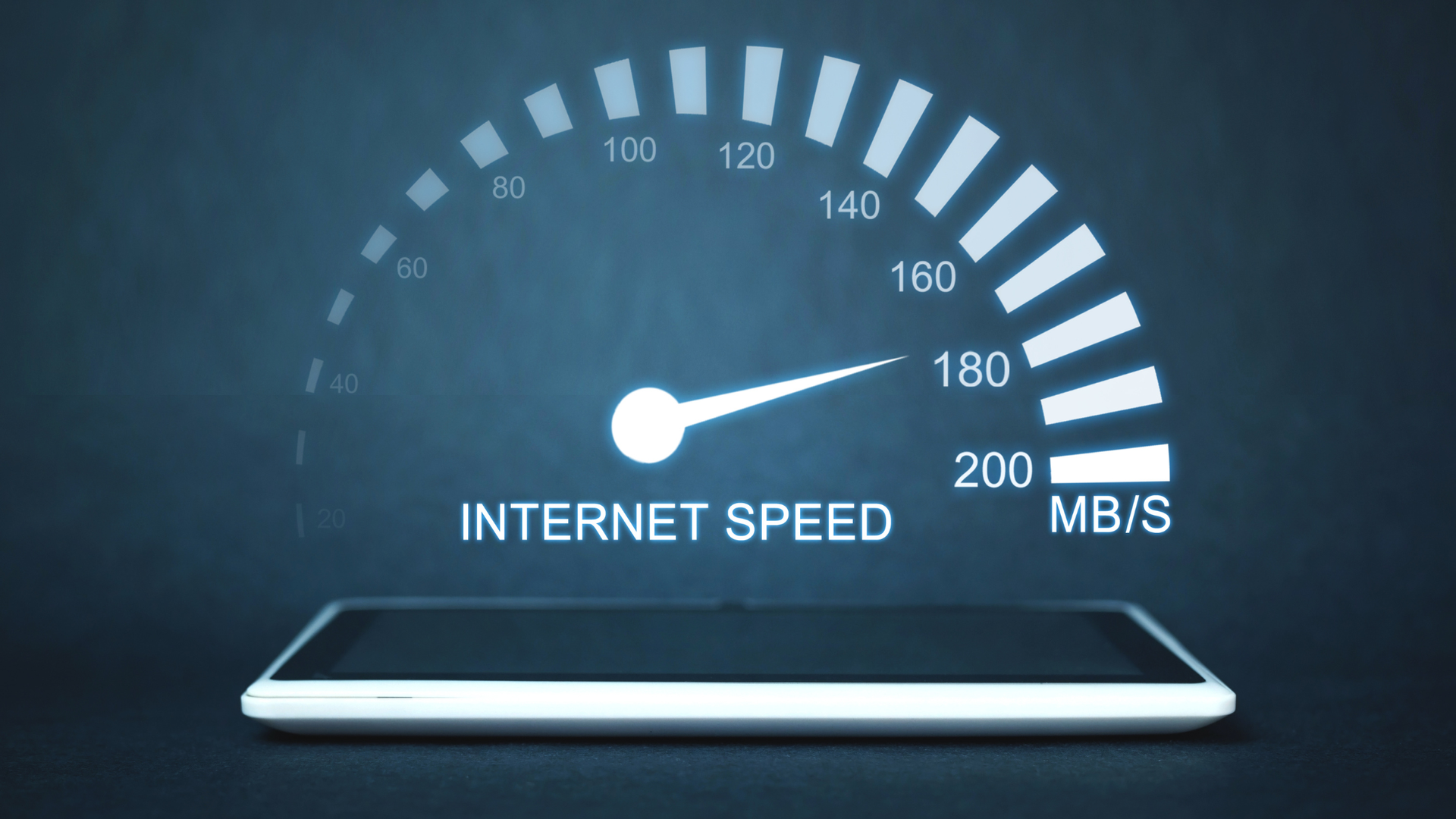 Tablet displaying a speedometer with the needle pointing to 160 Mb/s, labeled 
