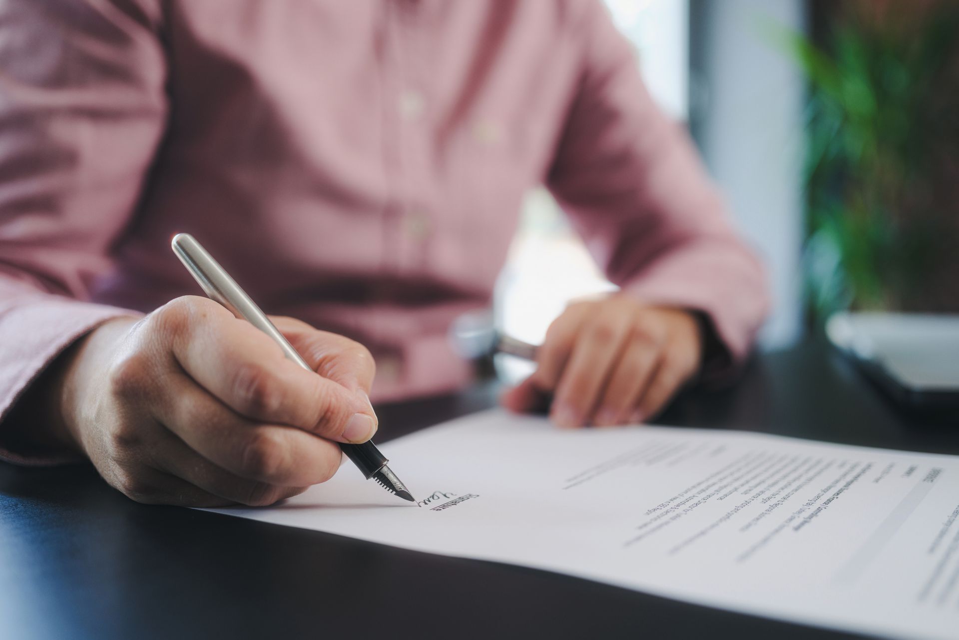 Person signing termination papers.