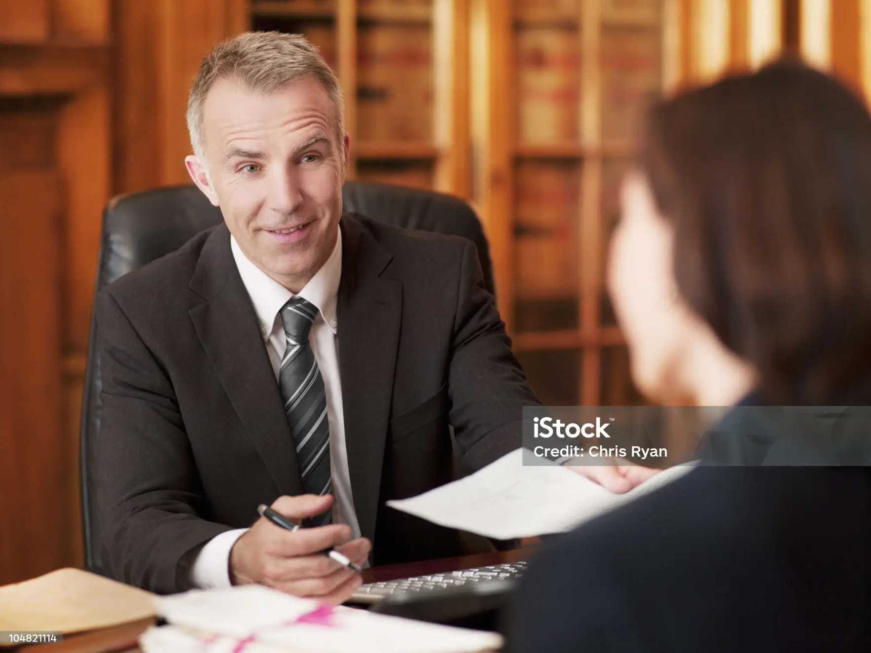 Disability lawyer consulting with a client about appealing a denied claim.