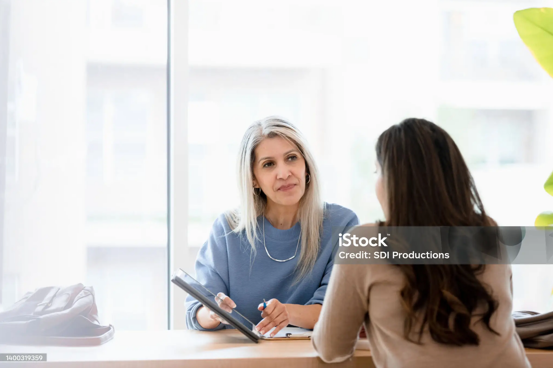 Lawyer meeting with a client, offering legal advice in a professional setting.