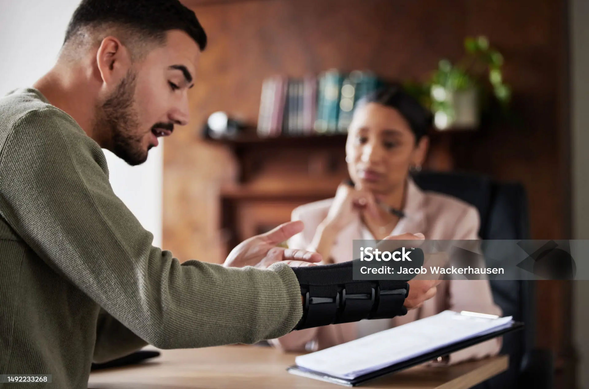 Client consulting with a long-term disability lawyer.