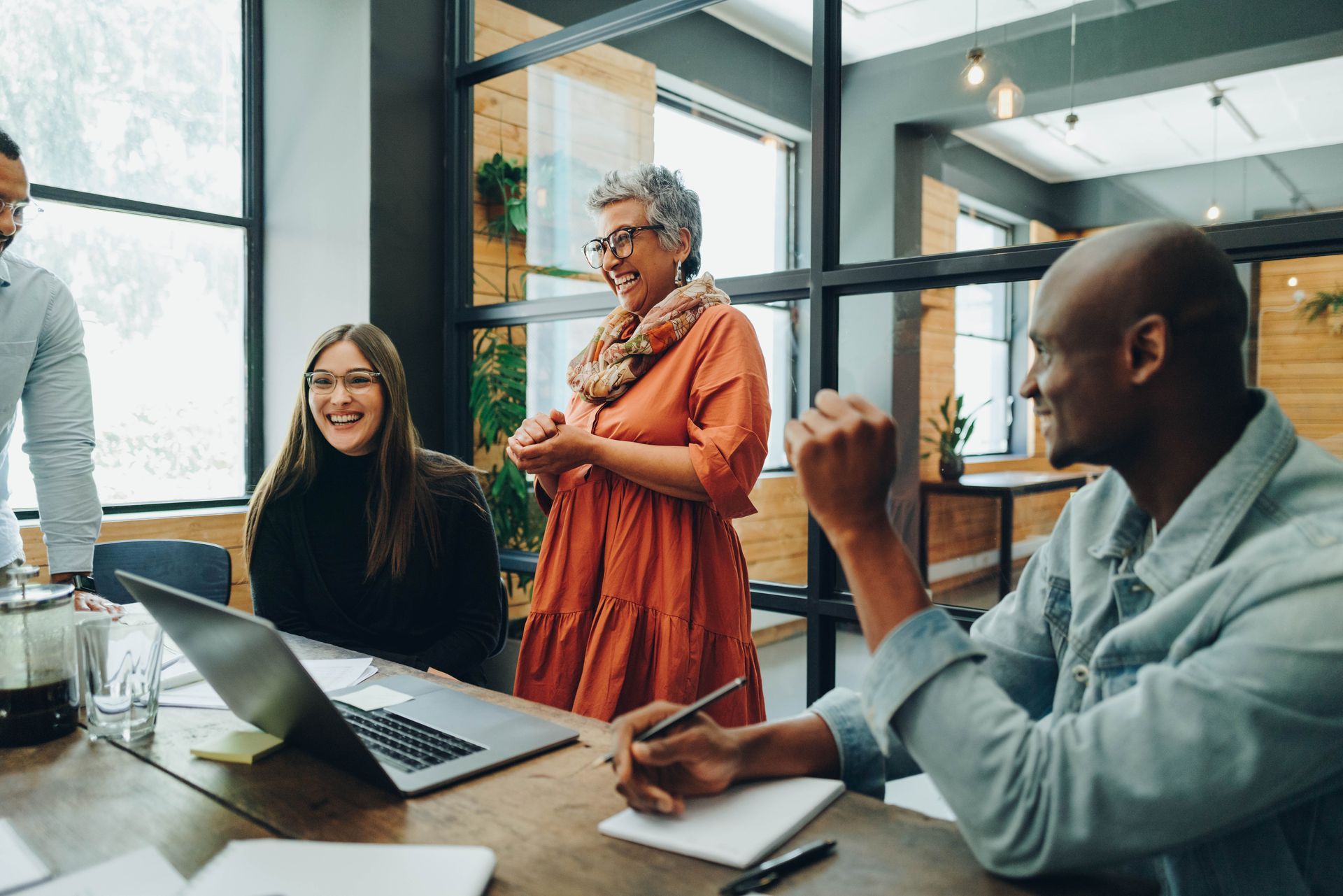 A diverse group of employees collaborating in a modern office.