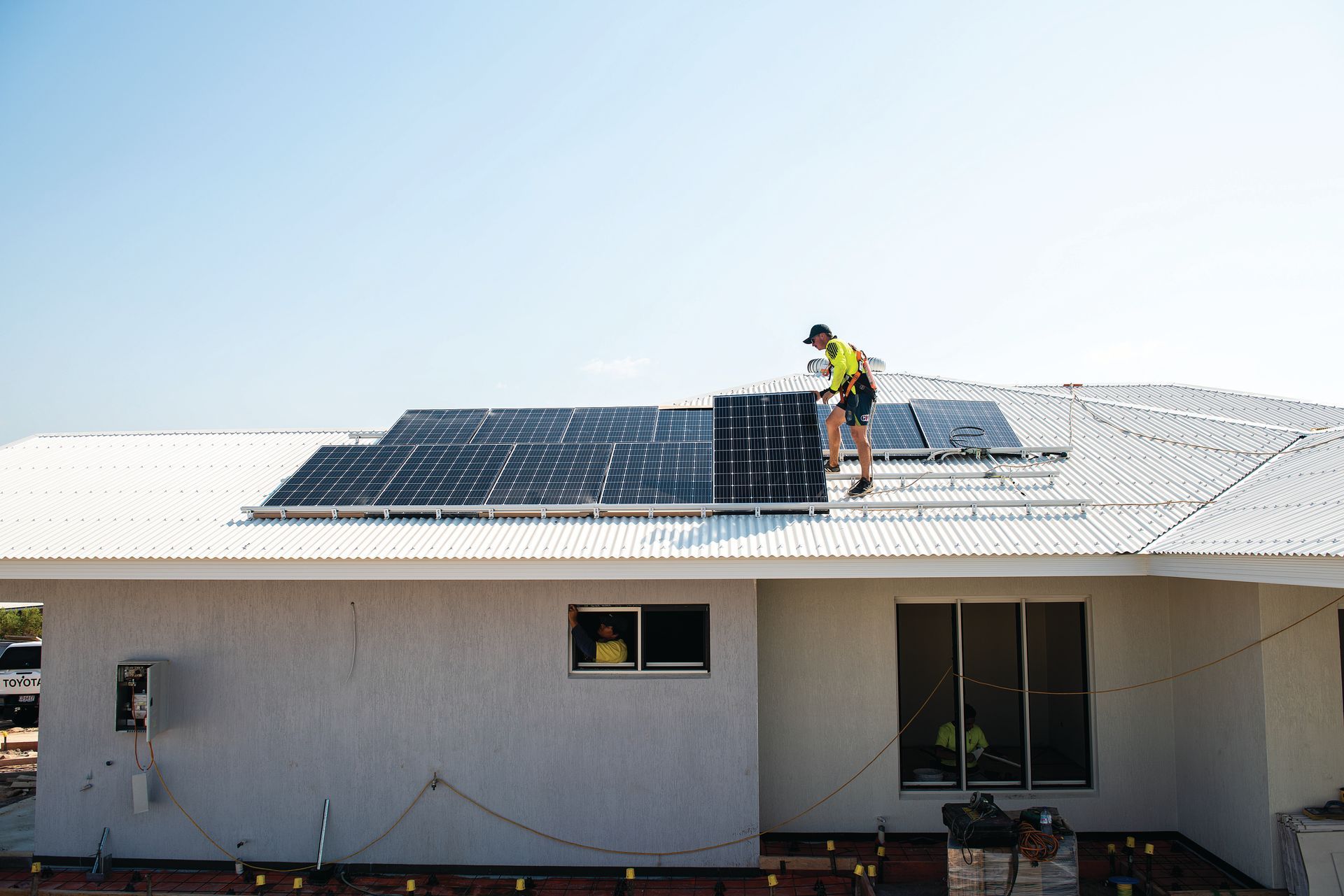 A Black and White Photo of A Row of Electrical Boxes on A Wall — Eco Sparks Solar & Electrical Contractors in Berrimah, NT