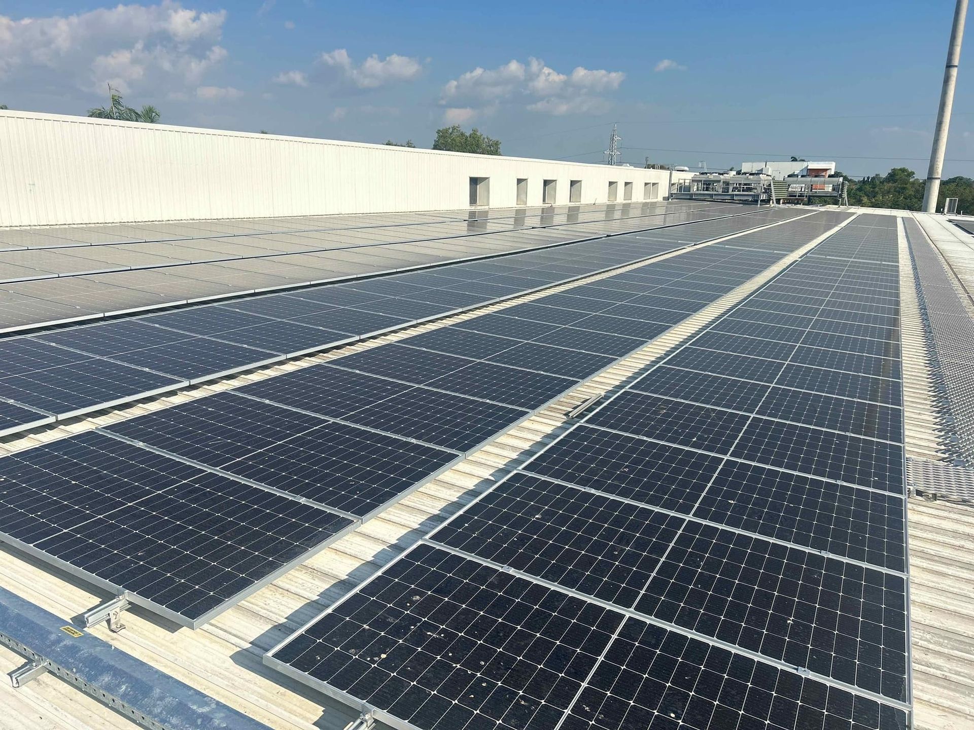 Rooftop Solar Panels Installed On A Commercial Building