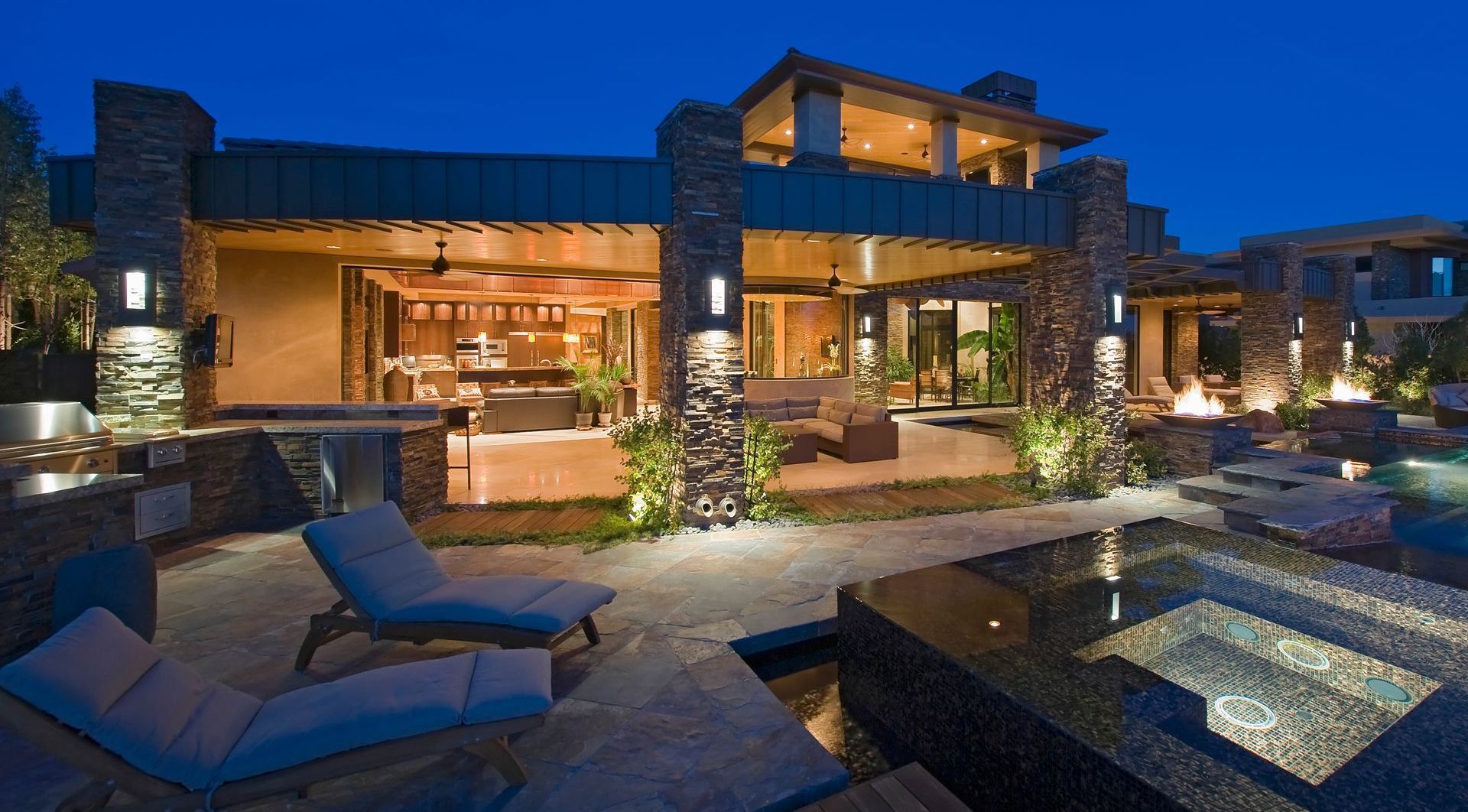 Exterior of contemporary house with plunge pool at dusk