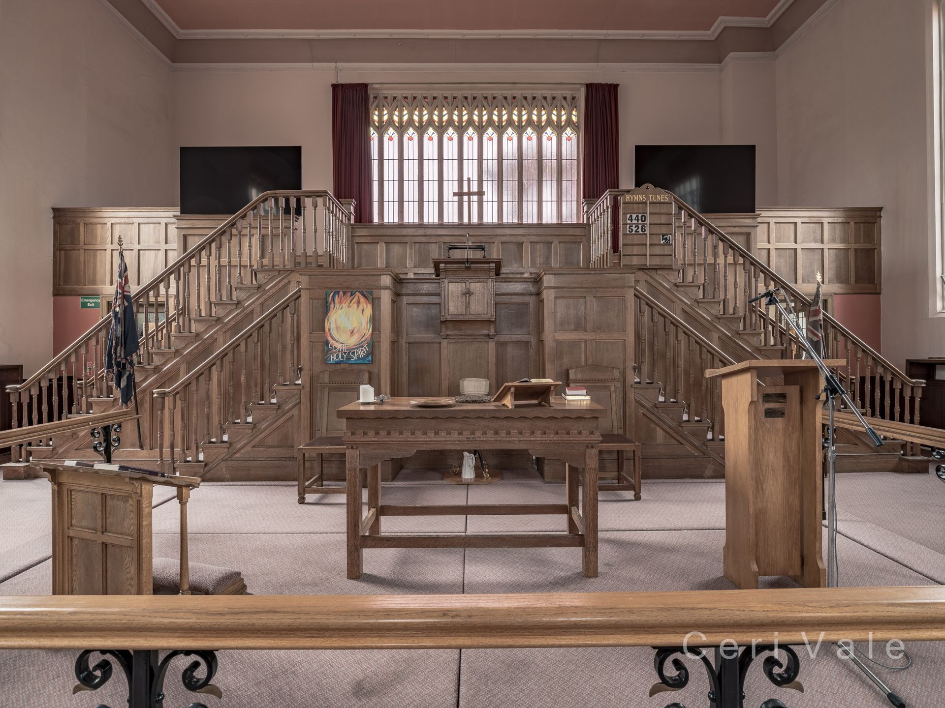 A church with a wooden podium and stairs
