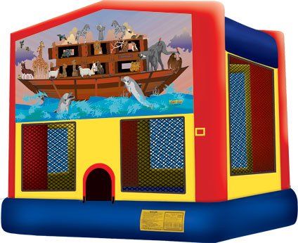 A happy birthday bouncy house is sitting on top of a lush green field.