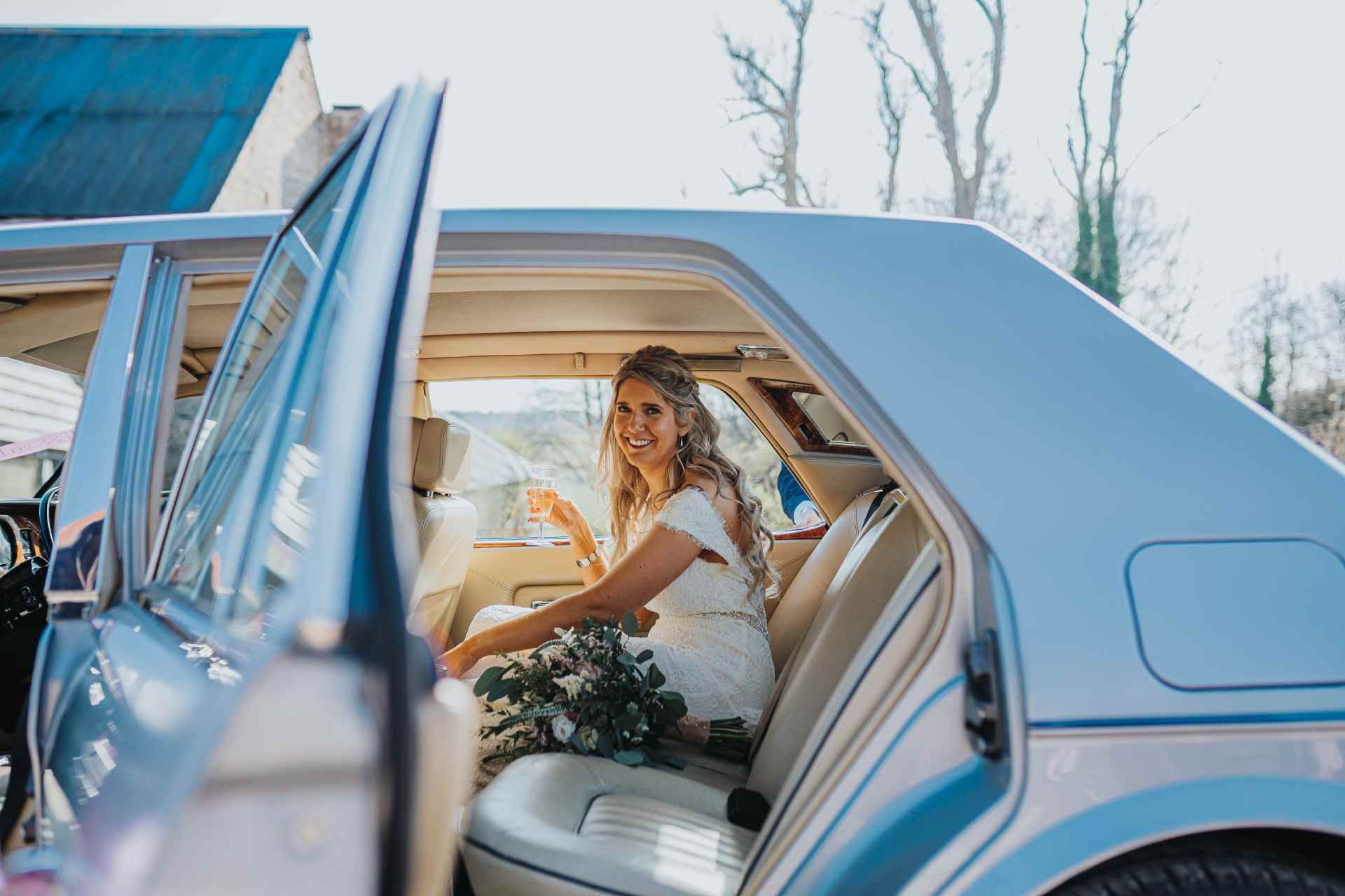 bride in a Mercedes on her wedding day 
