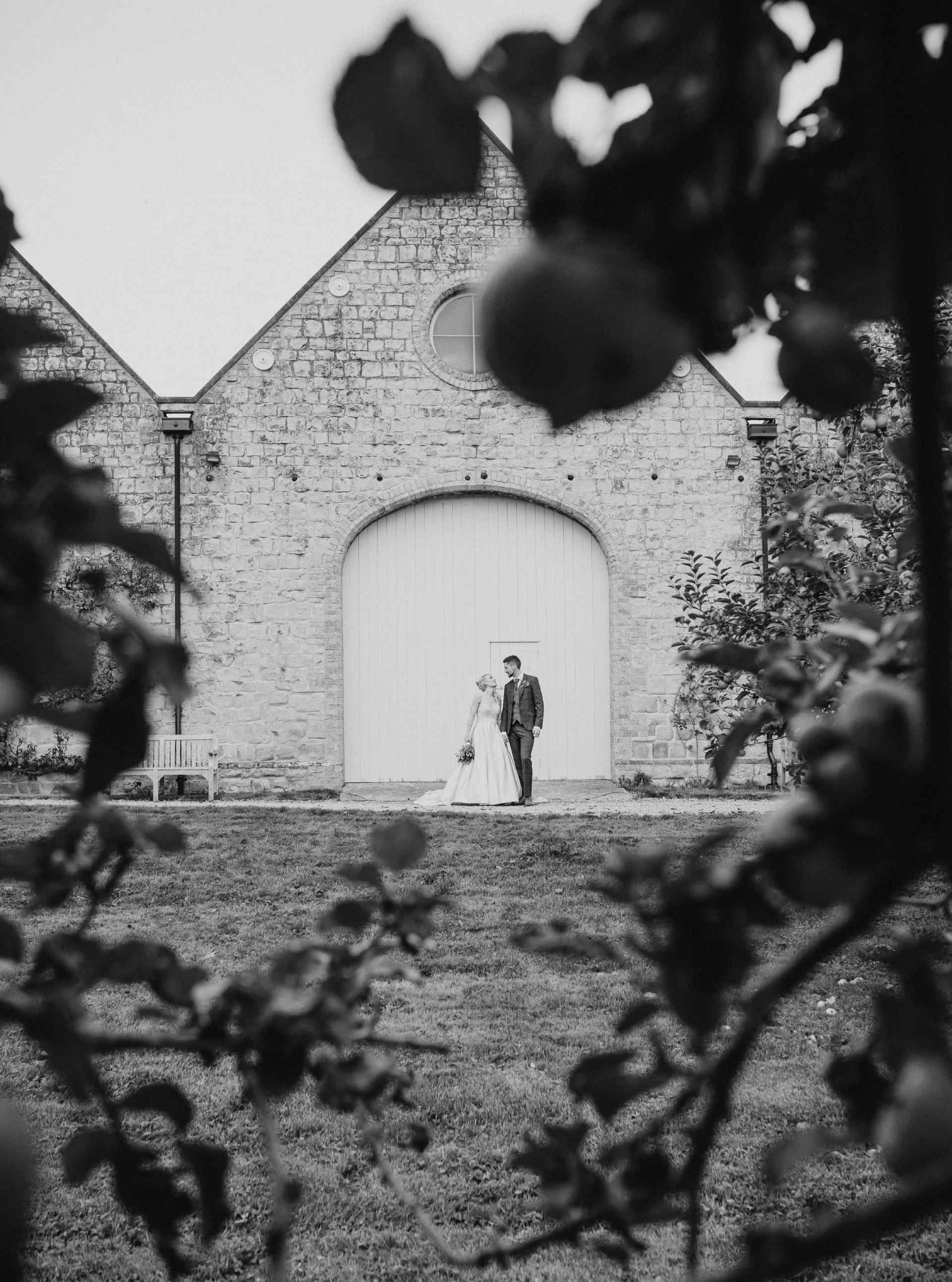 wedding couple portraits at barn door in Kineton warwickshire 