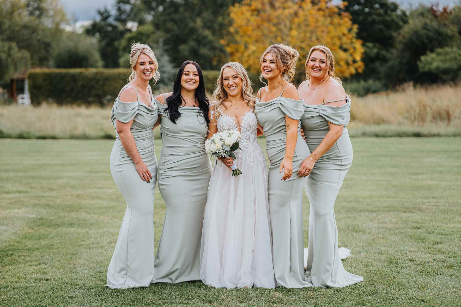 bride with her bridesmaids at wooten park 