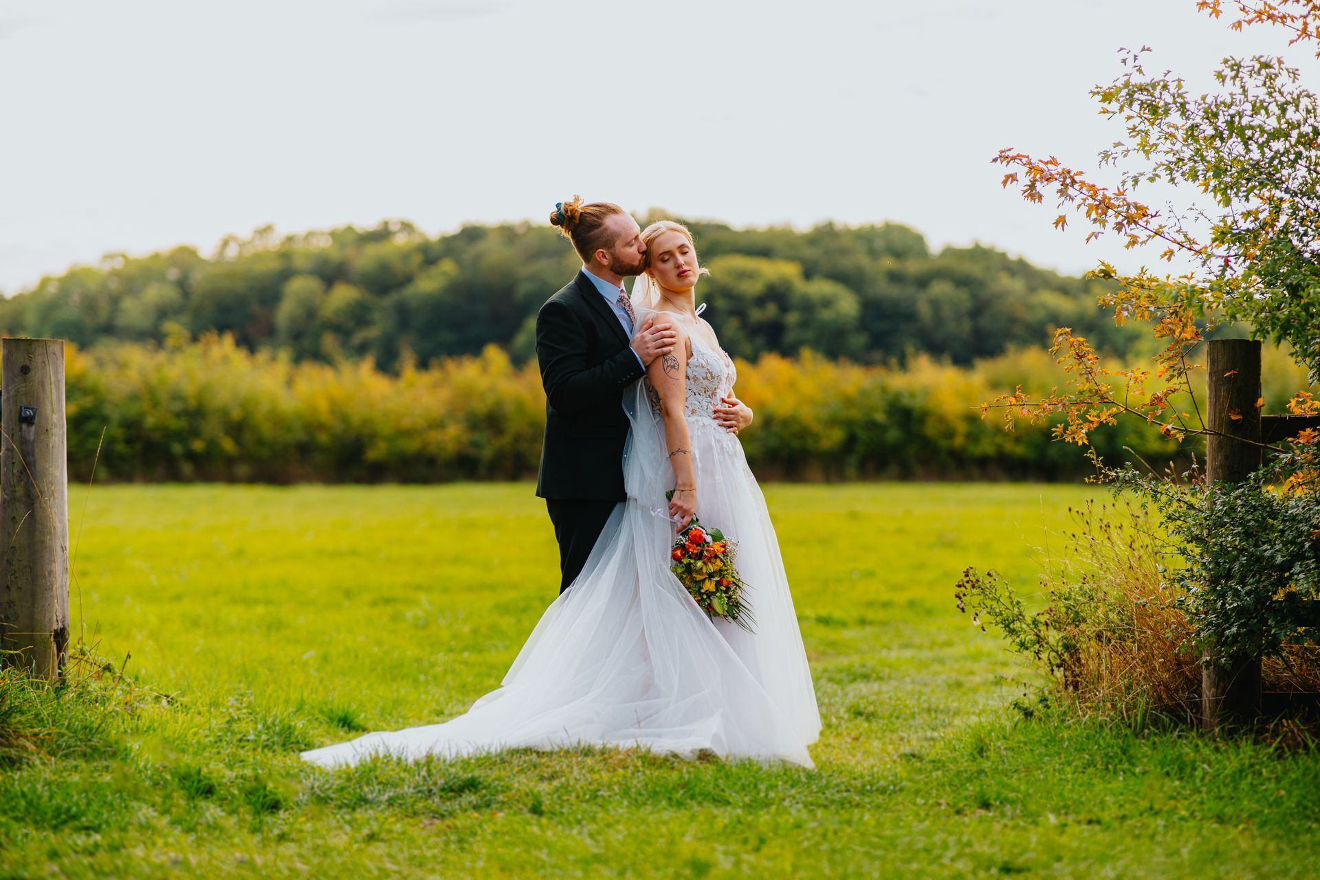 wedding couple portraits in a field at lapstone barn 