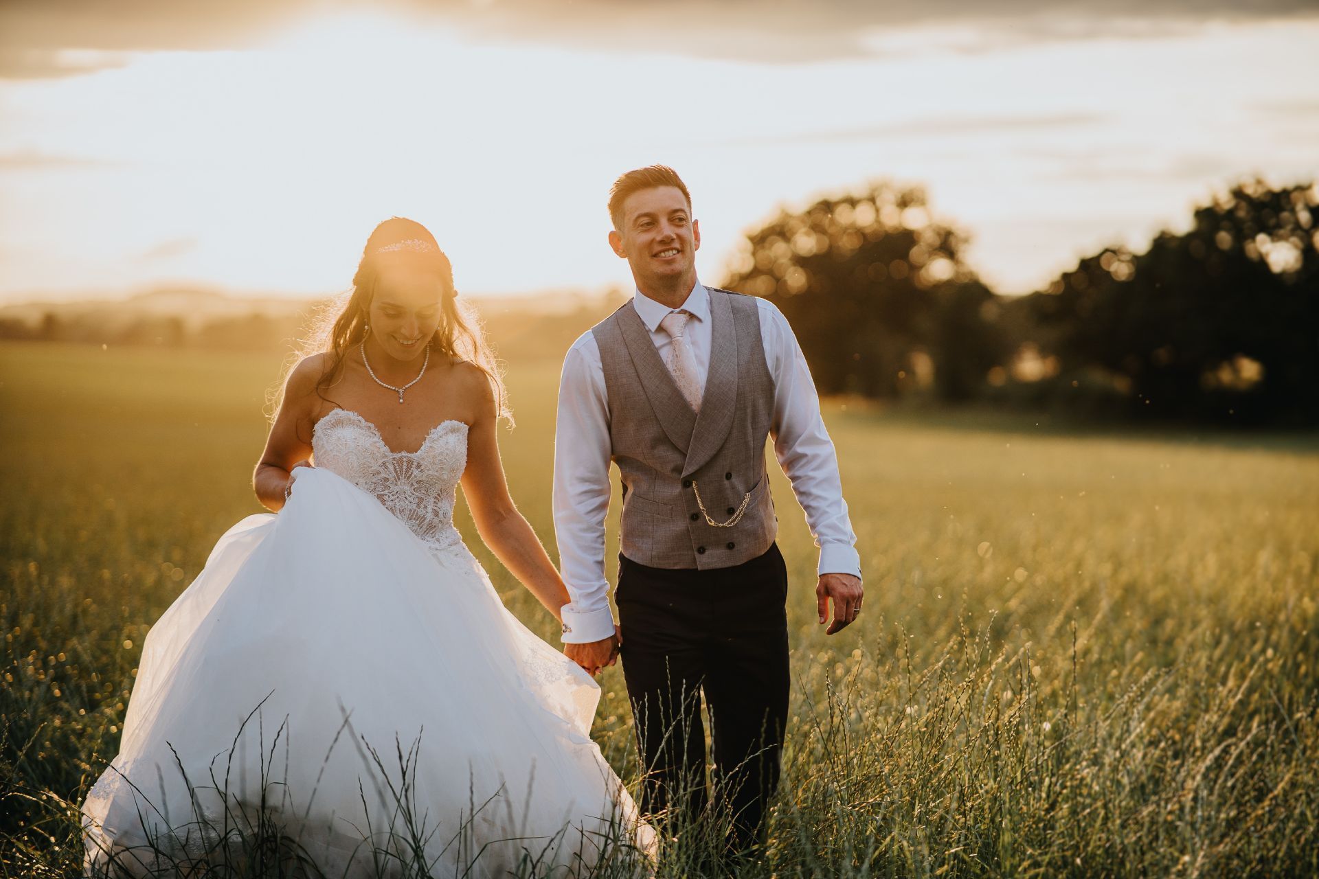 sunset wedding photo in a field at gazebo wedding on a farm 