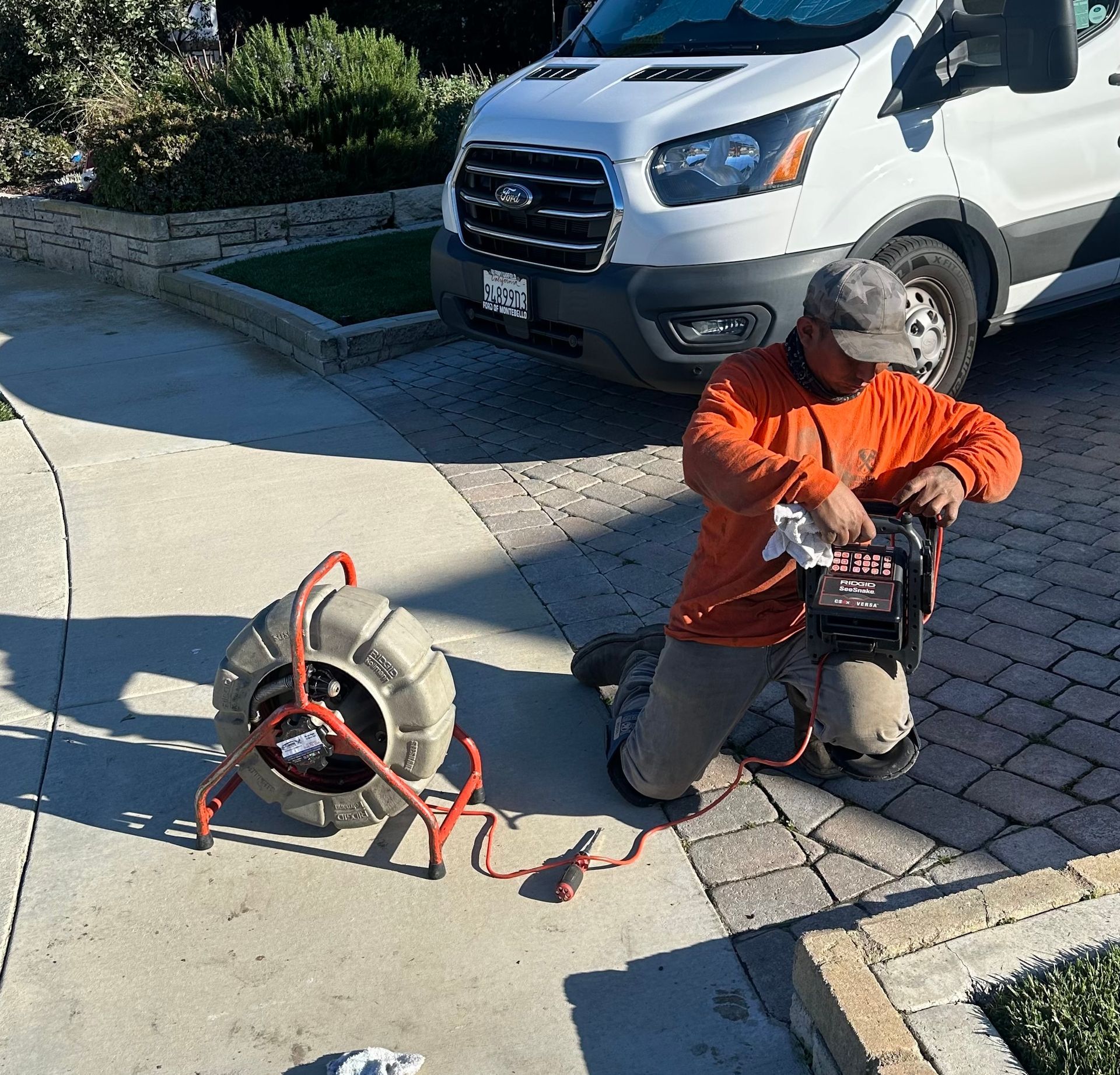 A Man Setting Up A Drain Cleaning - Anaheim, CA - J & L Plumbing Services
