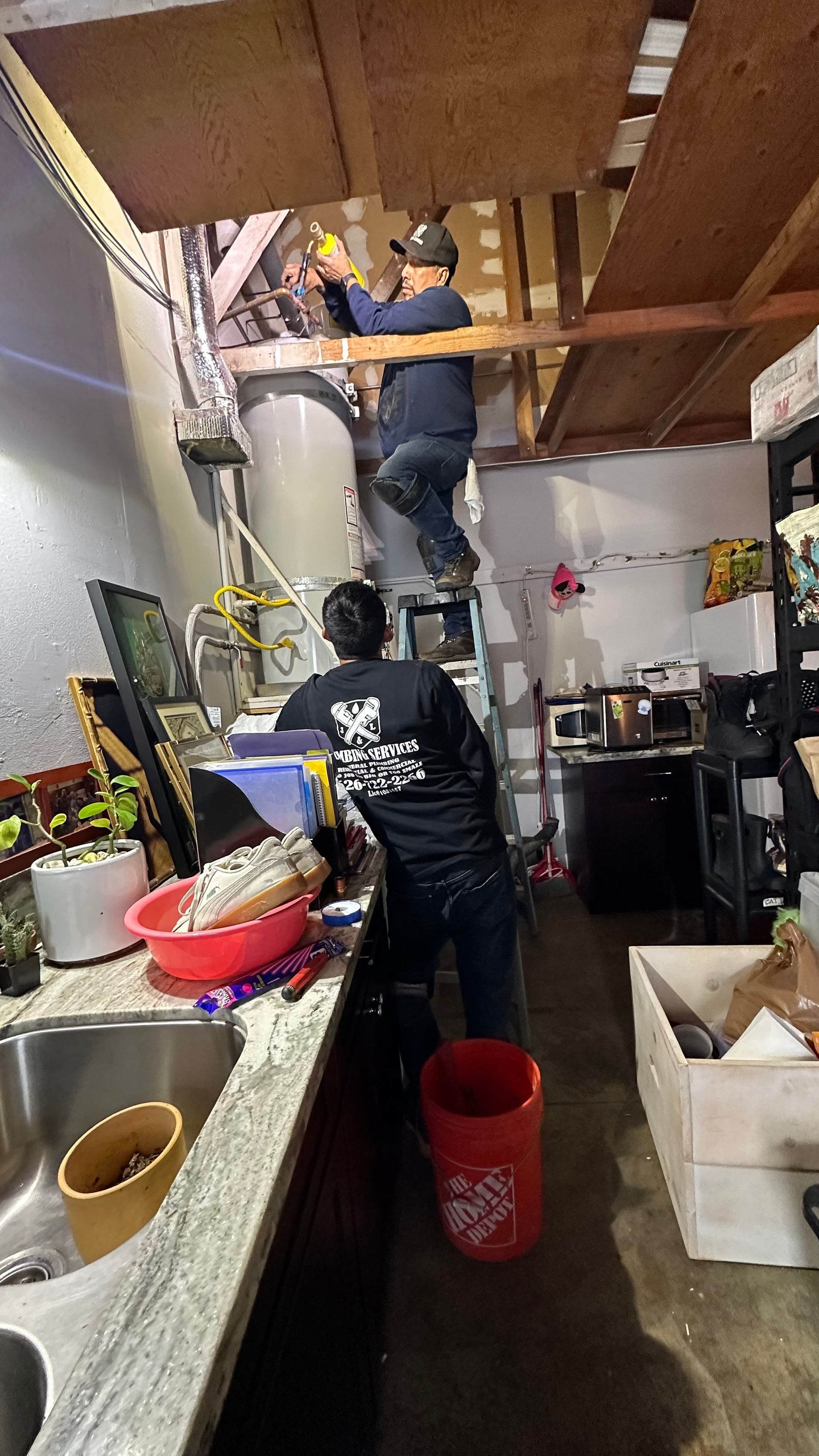 A Man Cleaning A Drain - Anaheim, CA - J & L Plumbing Services