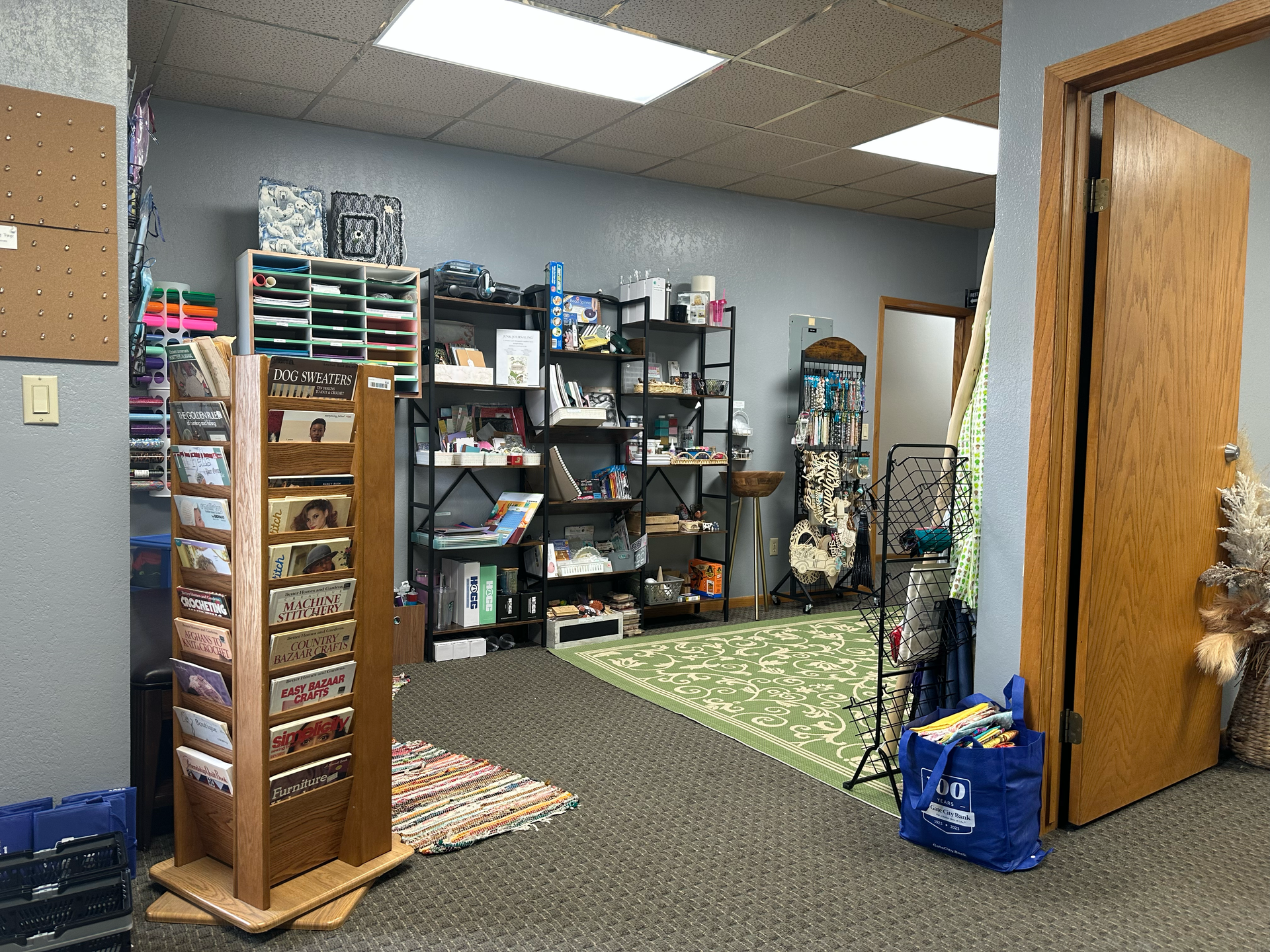 A craft store interior featuring shelving units, display racks, and various art supplies.