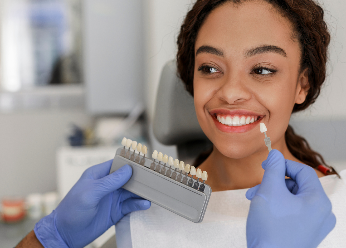 A man and a woman are standing next to each other and smiling.