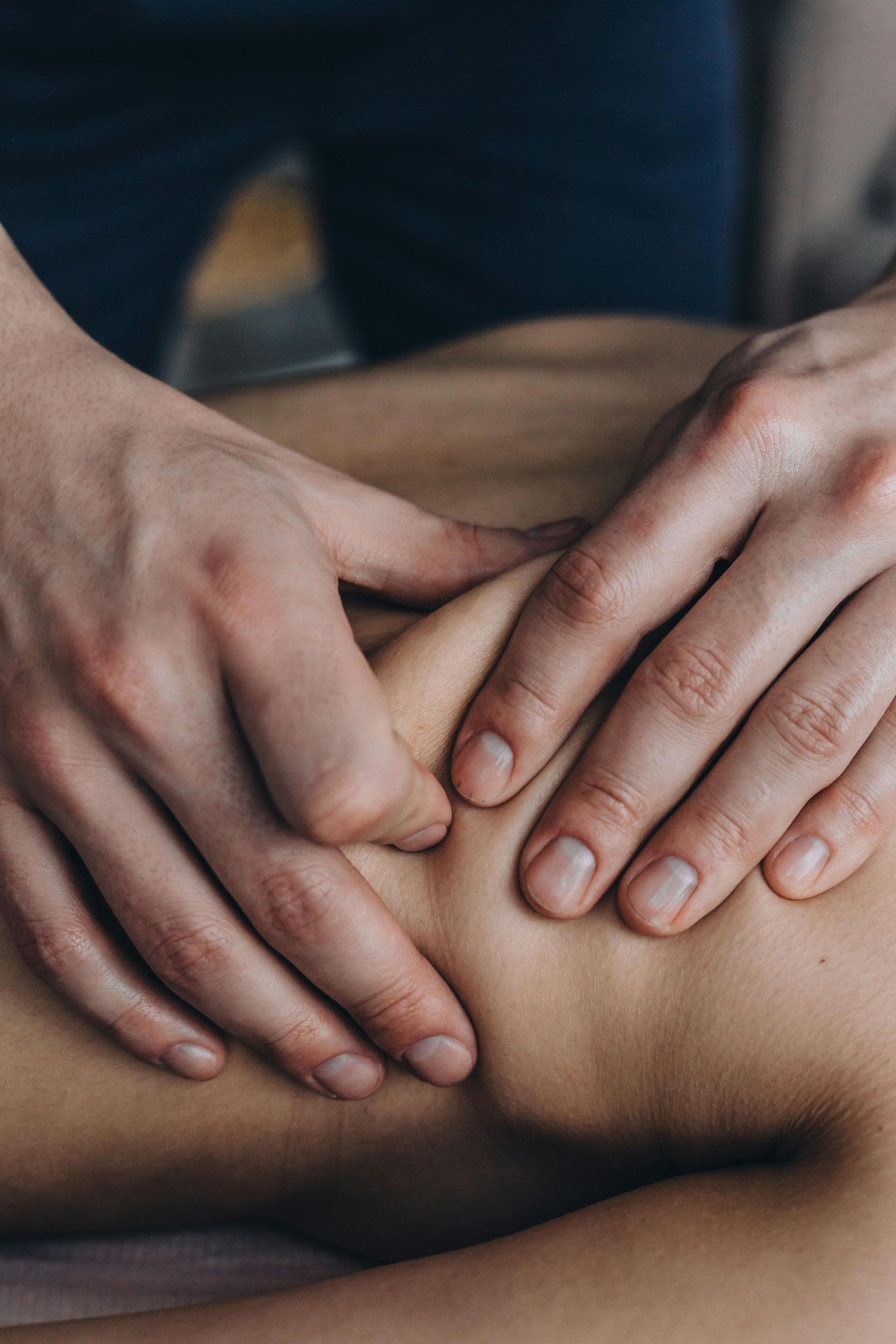 a man is getting a knee massage from a doctor .