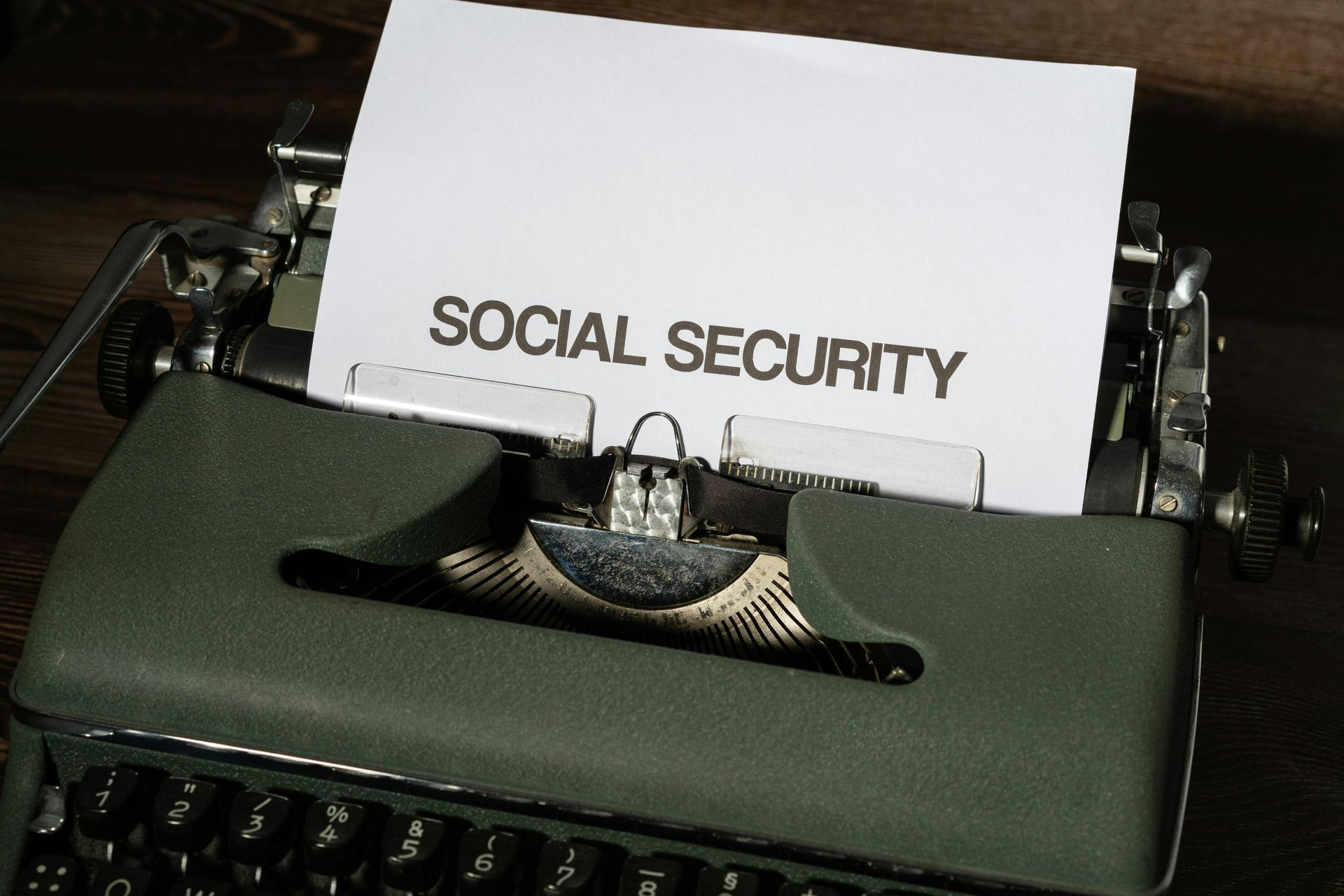 A typewriter with a piece of paper that says social security