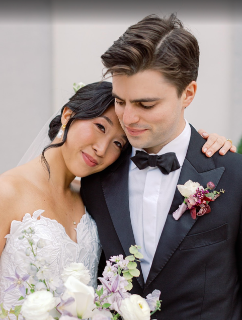 A long table with a vase of flowers on it.