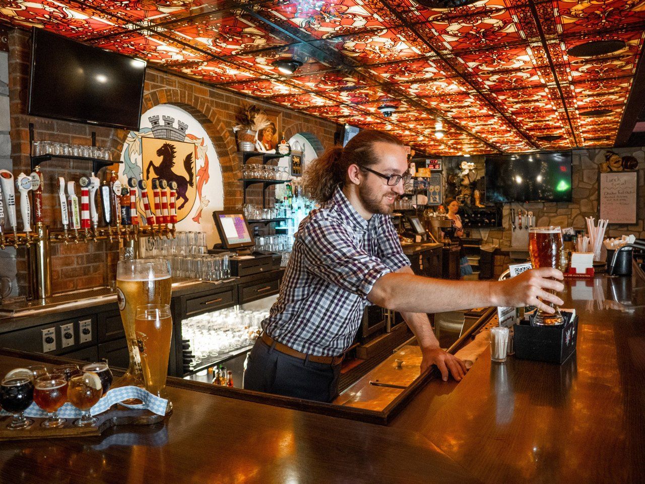 Man Giving A Beer — Jasper, IN — Schnitzelbank Restaurant