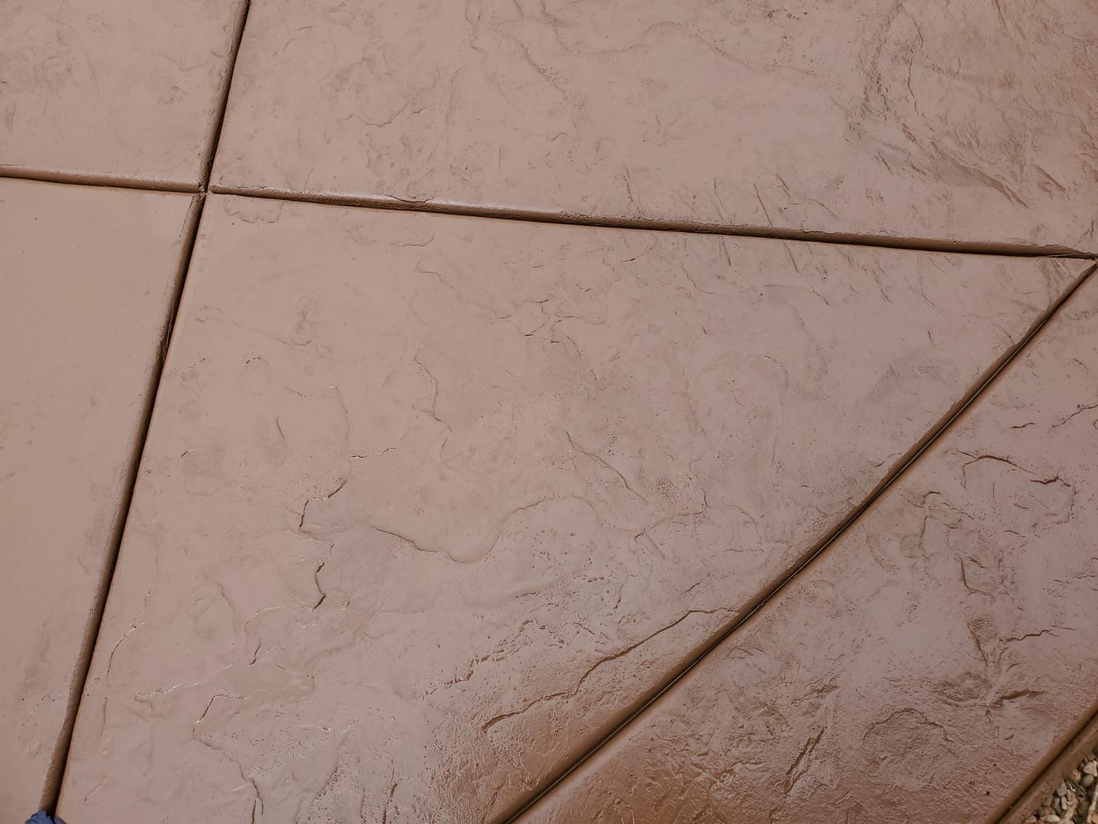 Tan tiled floor with dark grout lines.